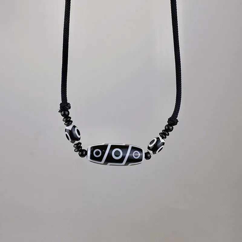 Tibetan Dzi Bead Necklace – Black & White Resin Amulet on Adjustable Rope