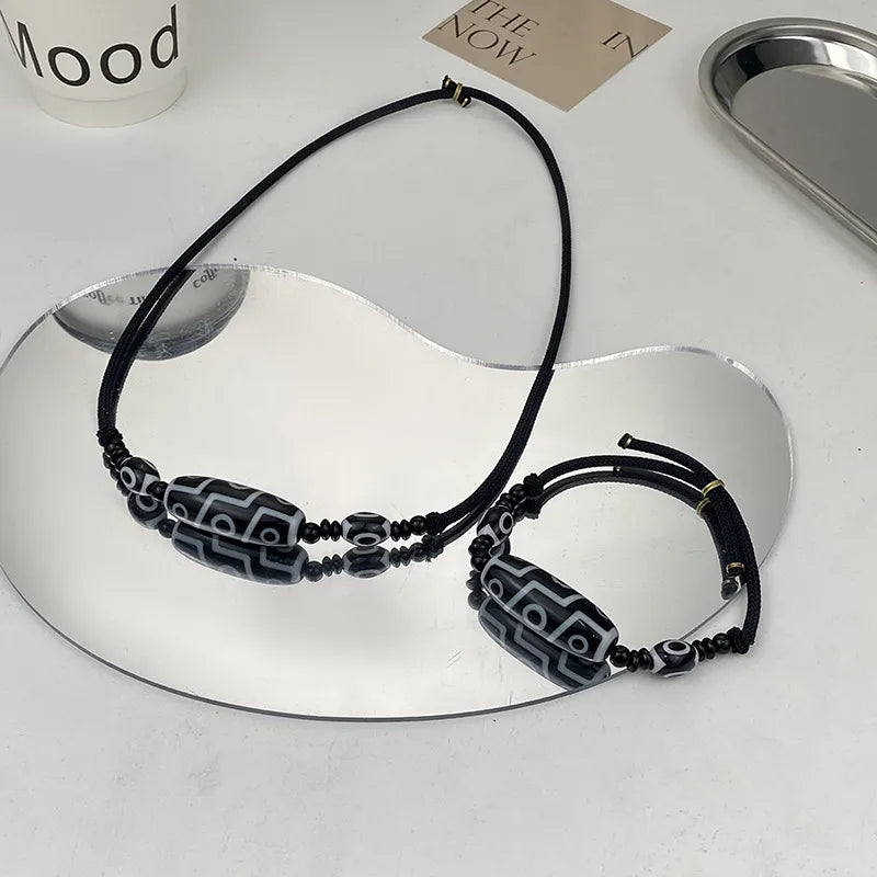 Tibetan Dzi Bead Necklace – Black & White Resin Amulet on Adjustable Rope